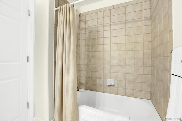 bathroom with shower / bath combination with curtain