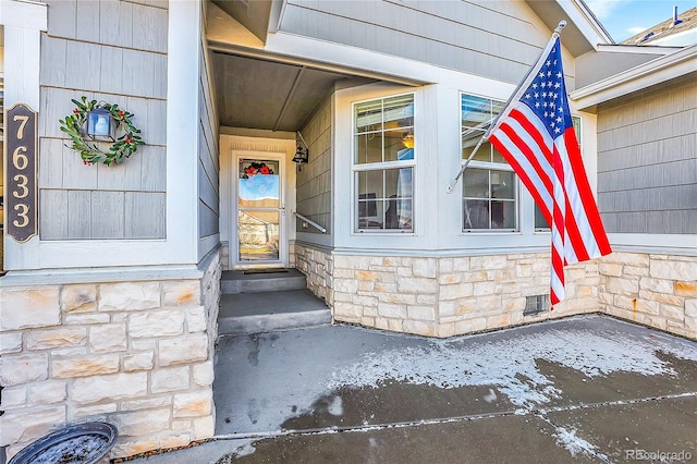 view of exterior entry with stone siding