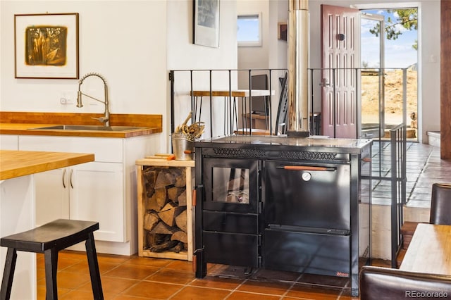11 Baca Mdws, Moffat, CO 81131 - bar area featuring a sink and dark tile patterned floors