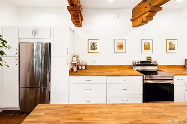 11 Baca Mdws, Moffat, CO 81131 - kitchen with wood counters, appliances with stainless steel finishes, and white cabinetry