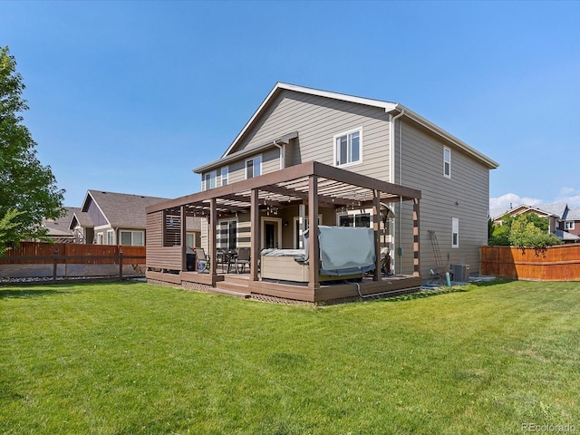 6832 Sequoia St, Frederick, CO 80530 - rear view of property with a fenced backyard, a hot tub, and a wooden deck