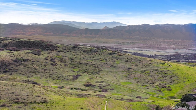 mountain view featuring a rural view
