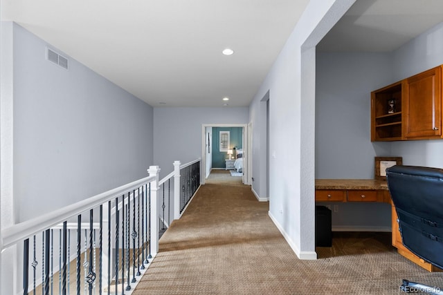 hall with baseboards, carpet flooring, recessed lighting, and visible vents