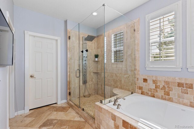 full bathroom featuring a garden tub, recessed lighting, baseboards, and a stall shower