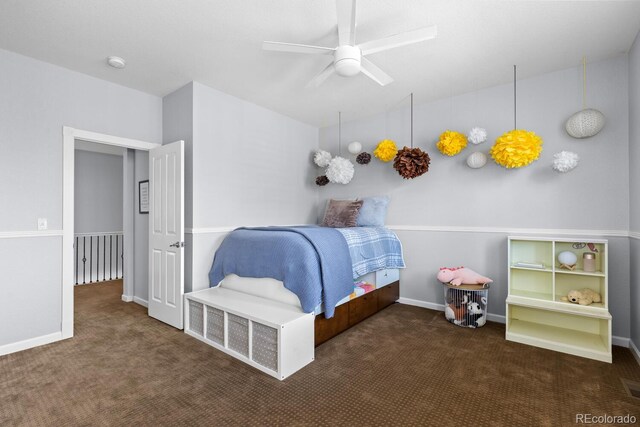 carpeted bedroom with baseboards and a ceiling fan