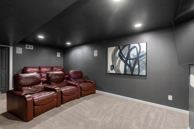 carpeted cinema room featuring baseboards, recessed lighting, and visible vents