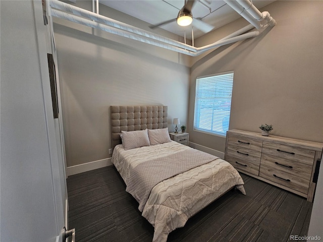 bedroom featuring baseboards and a ceiling fan