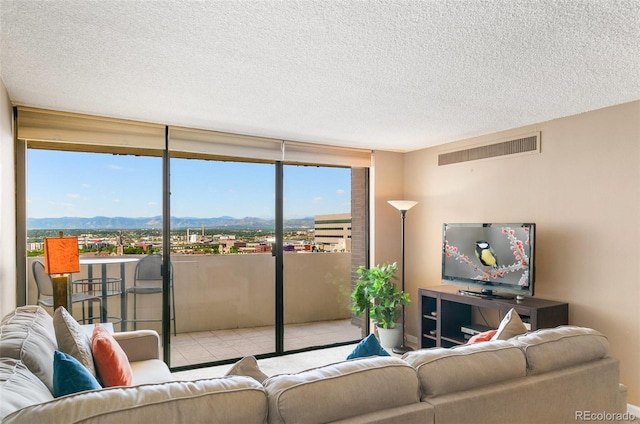 1020 15th St Unit 16A, Denver, CO 80202 - tiled living area with a textured ceiling, plenty of natural light, and a wall of windows
