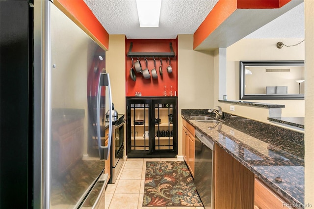 1020 15th St Unit 16A, Denver, CO 80202 - bathroom featuring a textured ceiling, tile patterned flooring, and vanity