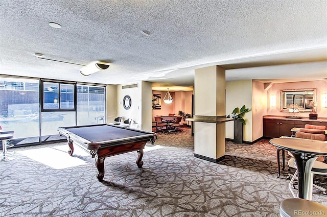 1020 15th St Unit 16A, Denver, CO 80202 - recreation room featuring carpet, billiards, a textured ceiling, a wall of windows, and baseboards