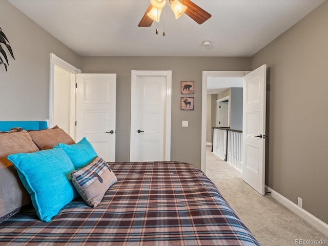 bedroom with light carpet and ceiling fan