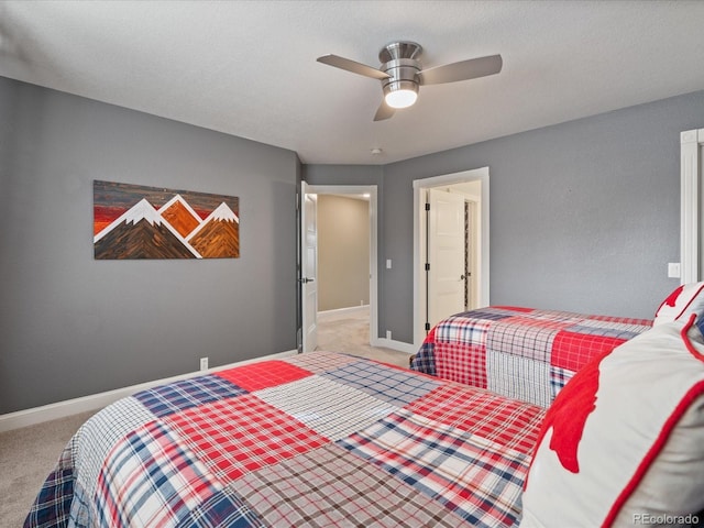 bedroom with ceiling fan and carpet floors