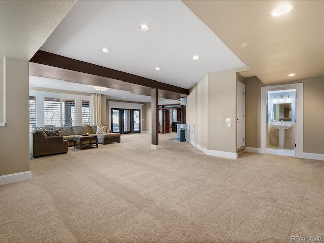 unfurnished living room featuring light colored carpet