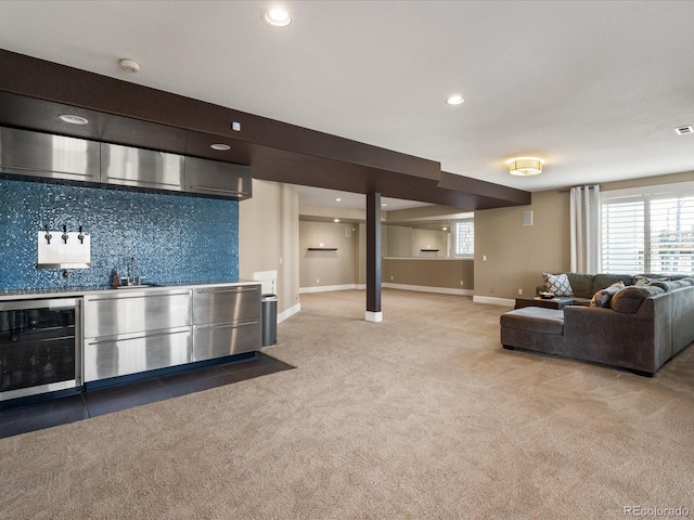 interior space featuring bar area, plenty of natural light, and beverage cooler