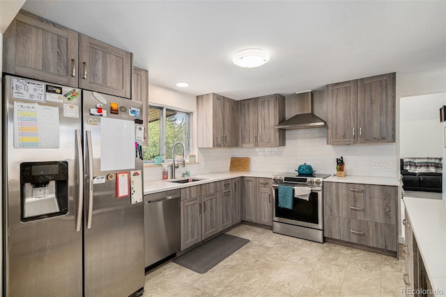6898 S Franklin Cir, Centennial, CO 80122 - kitchen with appliances with stainless steel finishes, wall chimney exhaust hood, light countertops, and decorative backsplash