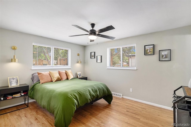 6898 S Franklin Cir, Centennial, CO 80122 - bedroom featuring wood finished floors and a ceiling fan