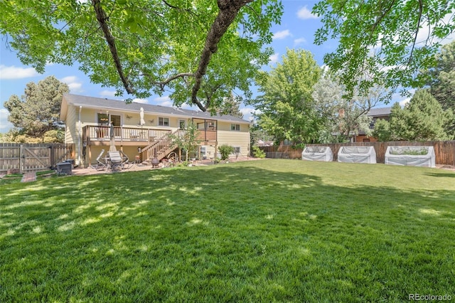 2315 N Murray Blvd, Colorado Springs, CO 80915 - fenced backyard featuring stairway, a wooden deck, and a swimming pool