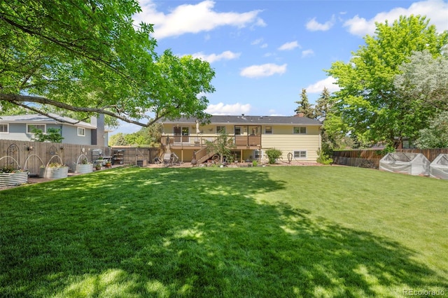 2315 N Murray Blvd, Colorado Springs, CO 80915 - back of property featuring stairway, a fenced backyard, and a deck
