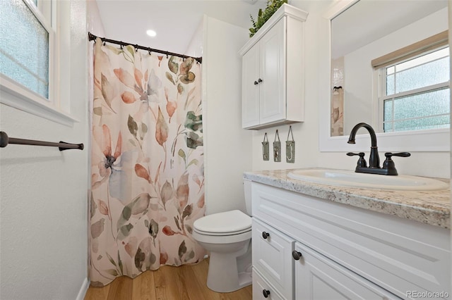 2315 N Murray Blvd, Colorado Springs, CO 80915 - full bath featuring vanity, wood finished floors, and a shower with curtain
