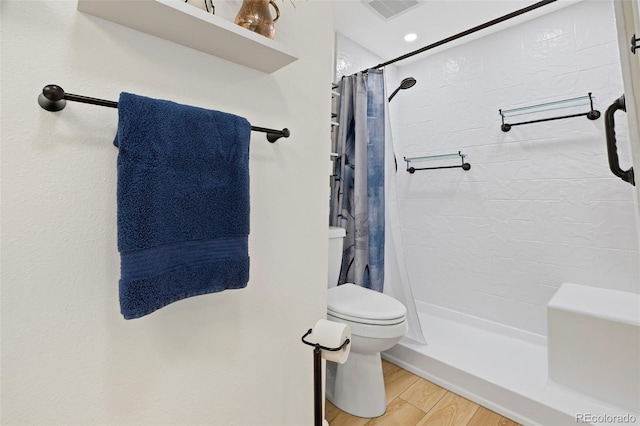 2315 N Murray Blvd, Colorado Springs, CO 80915 - bathroom featuring curtained shower and wood finished floors