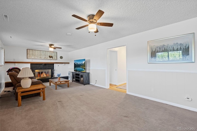 2315 N Murray Blvd, Colorado Springs, CO 80915 - carpeted living area with a fireplace, a ceiling fan, and a textured ceiling