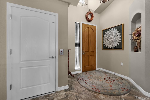 foyer with lofted ceiling