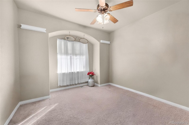 carpeted empty room with ceiling fan