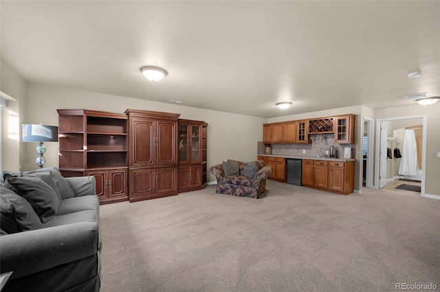 living room with light carpet and bar area