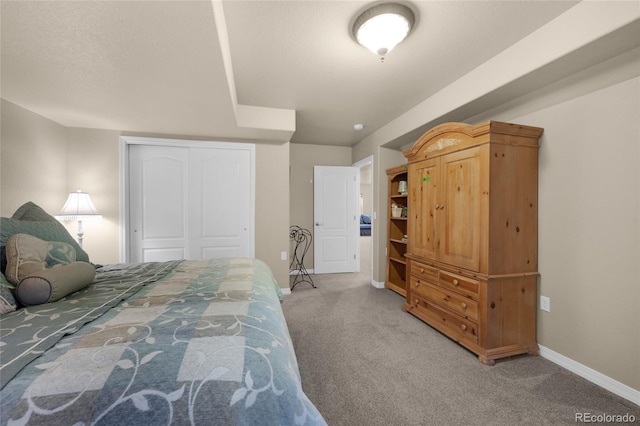 bedroom featuring carpet and a closet