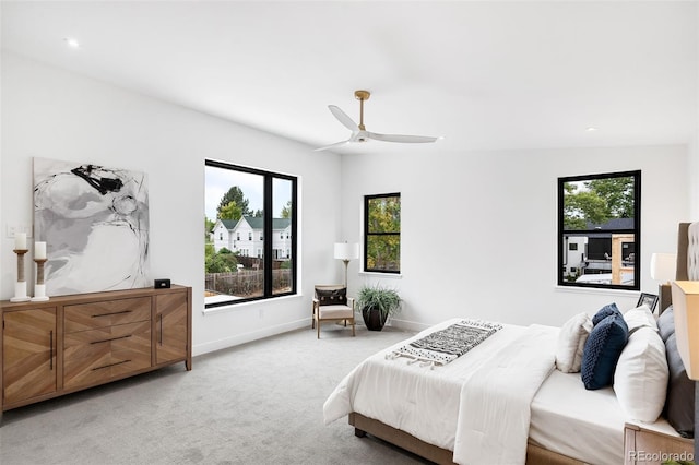 bedroom with vaulted ceiling, ceiling fan, and carpet floors