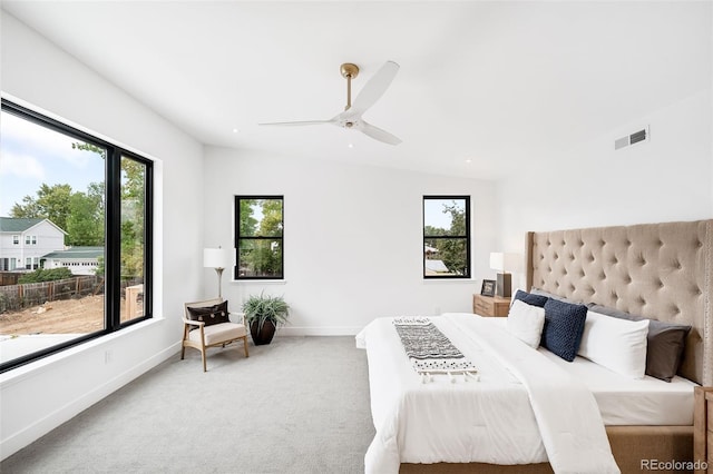 carpeted bedroom featuring vaulted ceiling and ceiling fan