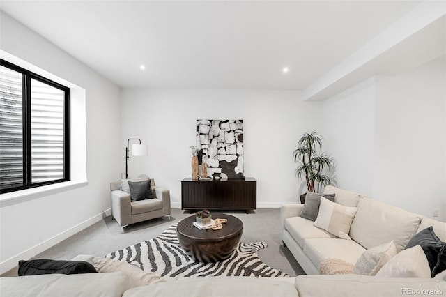 living room with light carpet and a wealth of natural light