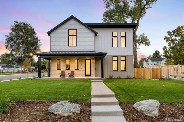 view of front of house with a yard