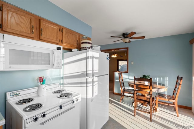 kitchen with ceiling fan and white appliances