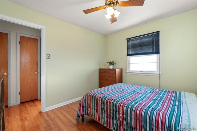 bedroom featuring ceiling fan and light hardwood / wood-style floors