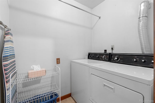 laundry room with independent washer and dryer