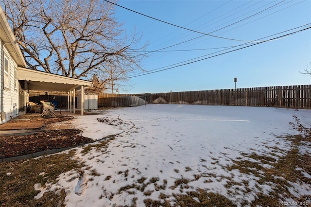 view of yard covered in snow