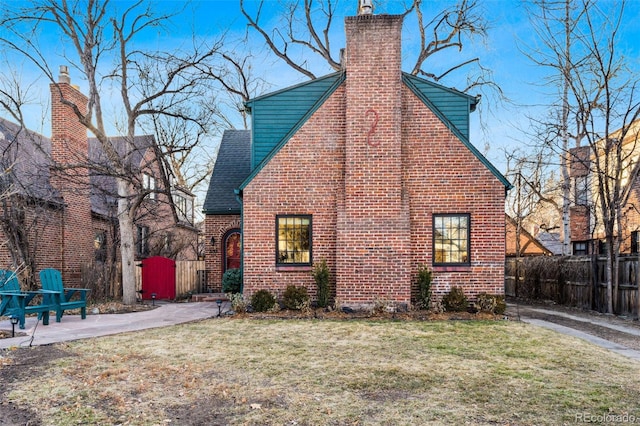 view of side of property with a yard