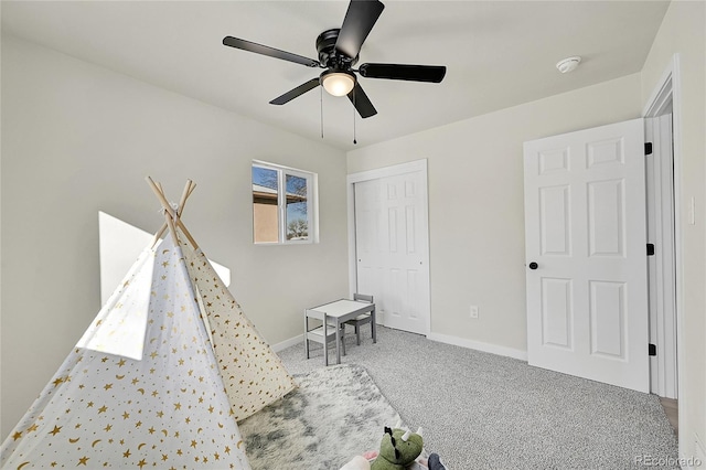 playroom featuring carpet floors and ceiling fan