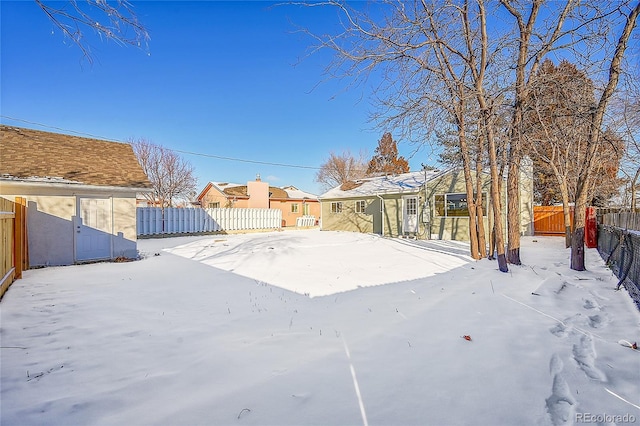 view of yard covered in snow