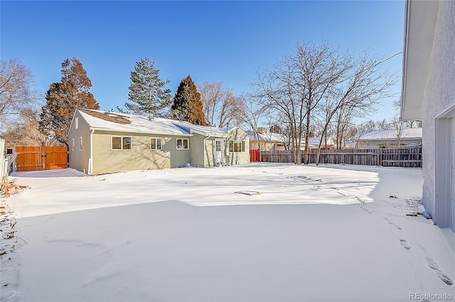 view of yard layered in snow