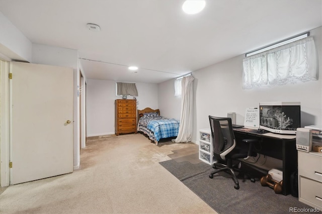 bedroom with light carpet and baseboards