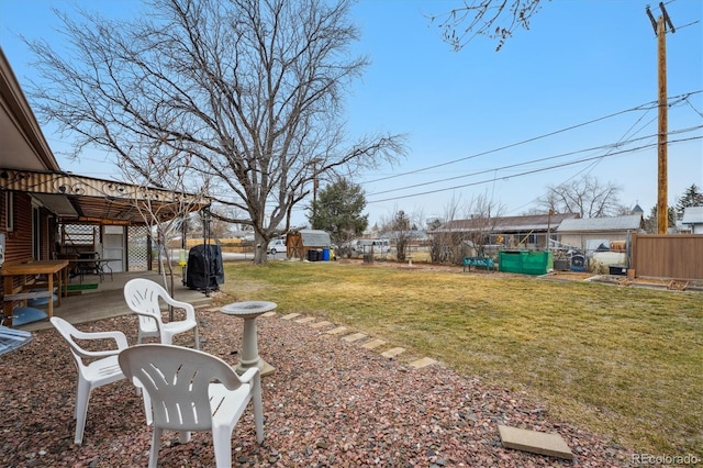 view of yard featuring a patio and fence