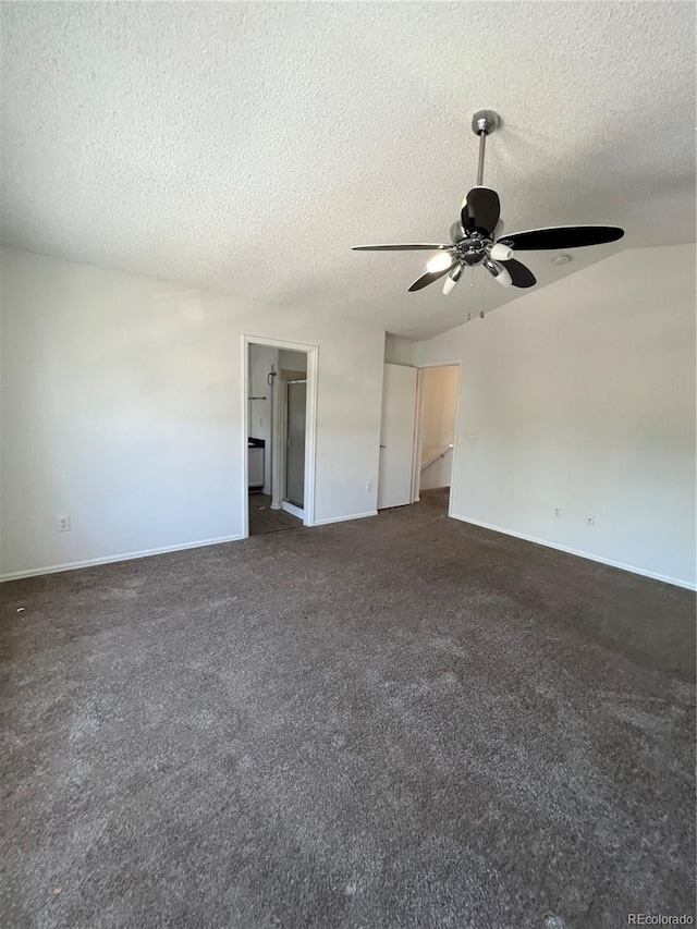 unfurnished room with ceiling fan, a textured ceiling, and dark carpet