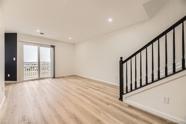 3200 S Federal Blvd Unit 5, Denver, CO 80236 - spare room with stairway, wood finished floors, and recessed lighting