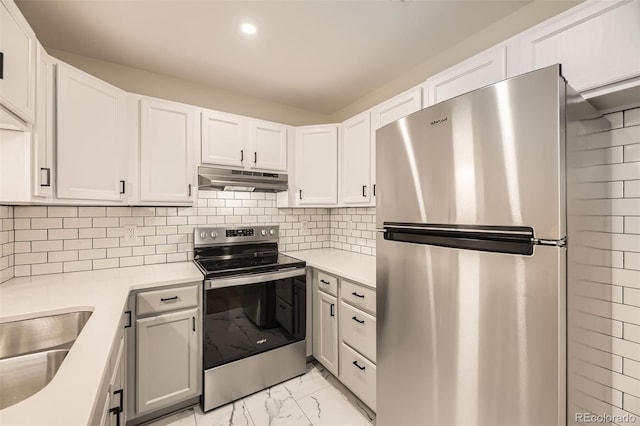 3200 S Federal Blvd Unit 5, Denver, CO 80236 - kitchen featuring stainless steel appliances, under cabinet range hood, light marble finish floors, recessed lighting, and light countertops