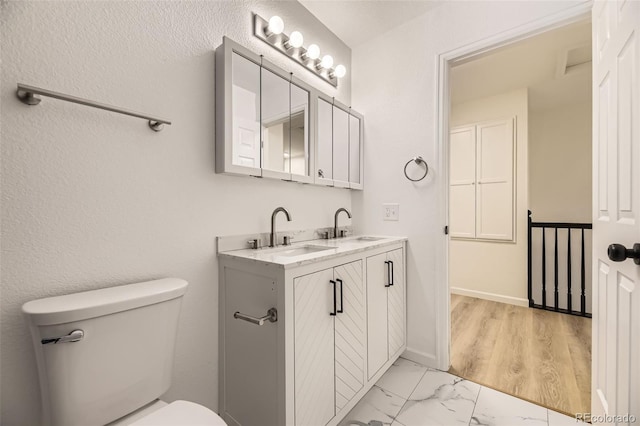 3200 S Federal Blvd Unit 5, Denver, CO 80236 - bathroom featuring double vanity and marble look tiles