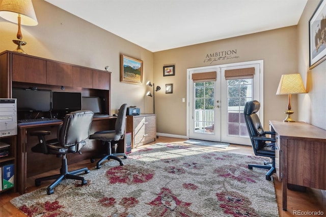 office space with french doors and light wood-type flooring