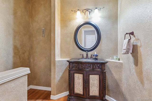 bathroom featuring vanity and wood-type flooring