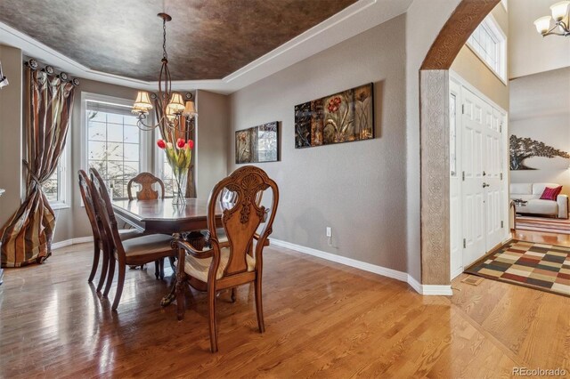 dining room featuring a chandelier and light hardwood / wood-style floors